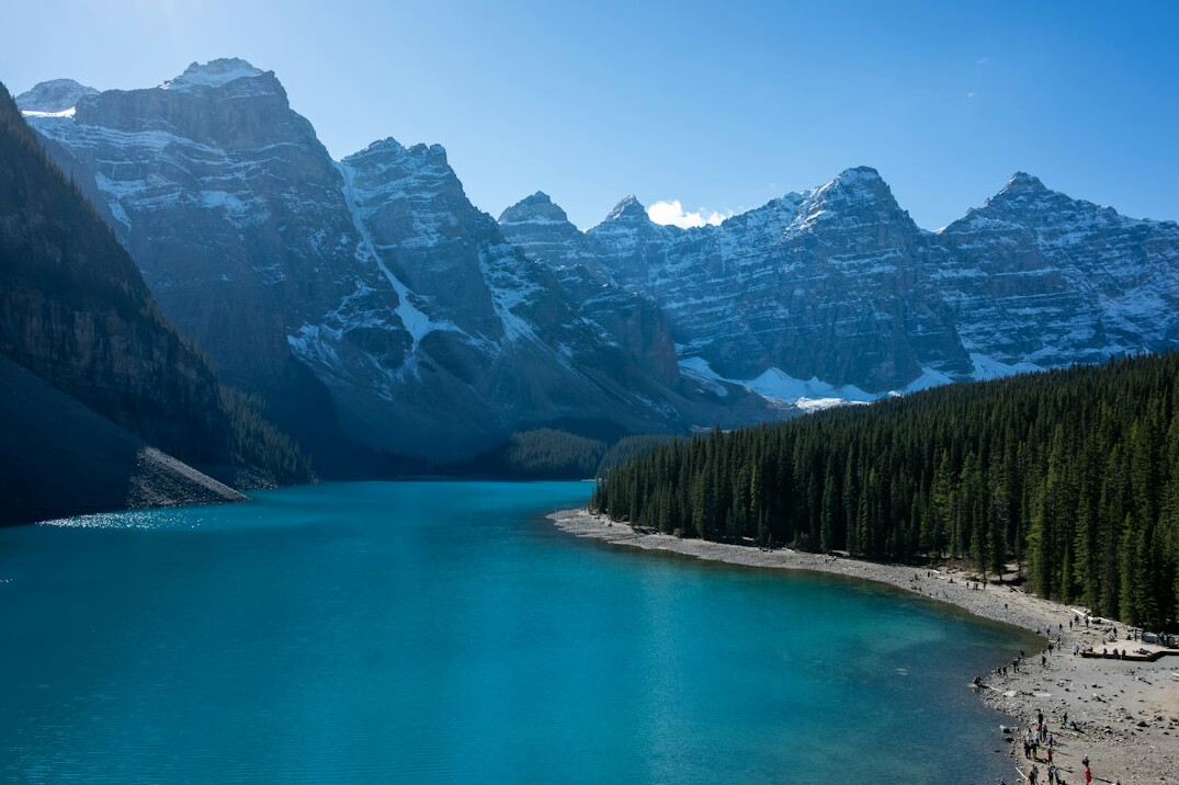 Snow capped mountains and turquoise lake in Banff National Park Canada