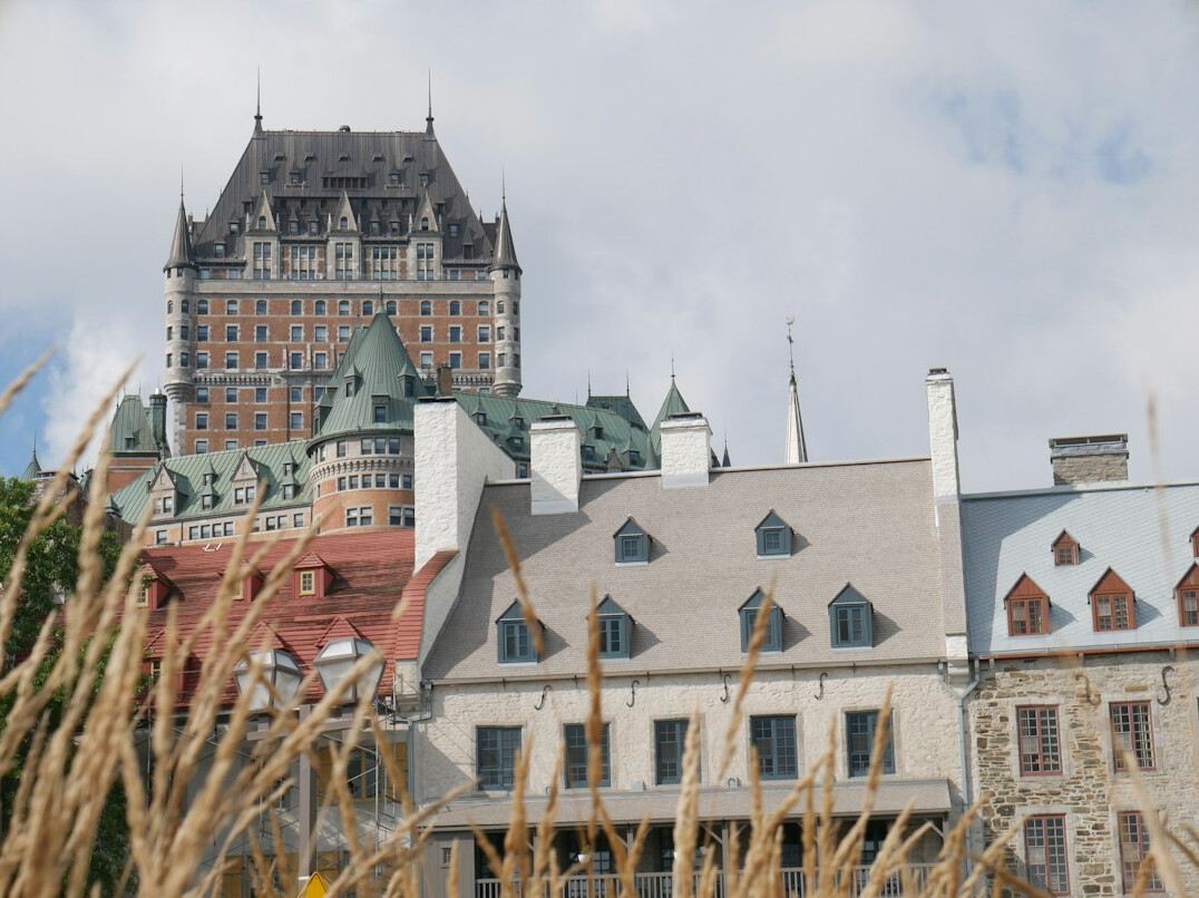 Cobblestone street with historic stone buildings in Old Quebec City