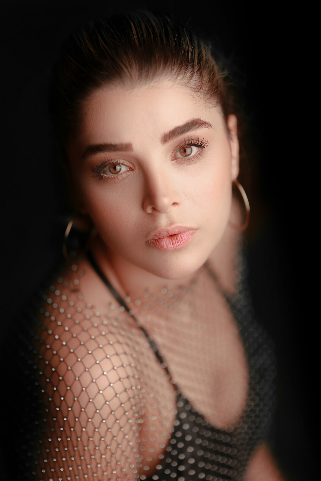 Studio portrait of a white Canadian woman photo editor